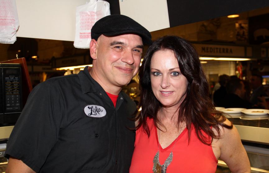 Image of Michael Symon with his wife, Liz Shanahan